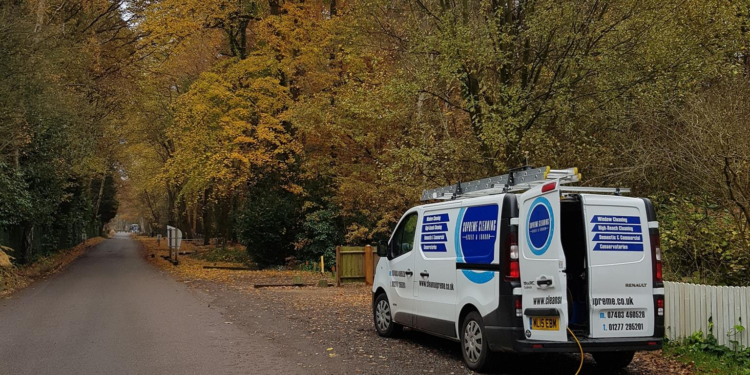 A clean supreme window cleaning van in Brentwood countryside